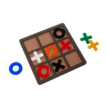 Load image into Gallery viewer, Naughts and crosses set from Scotch &amp; Sofa with some pieces laying outside the playing tray.
