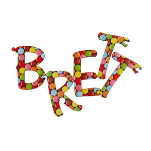 Alphabet puzzle letters displaying the name "Brett".