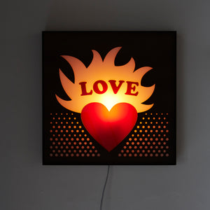 Mounted Love Sign Light litten up with no room lights on.